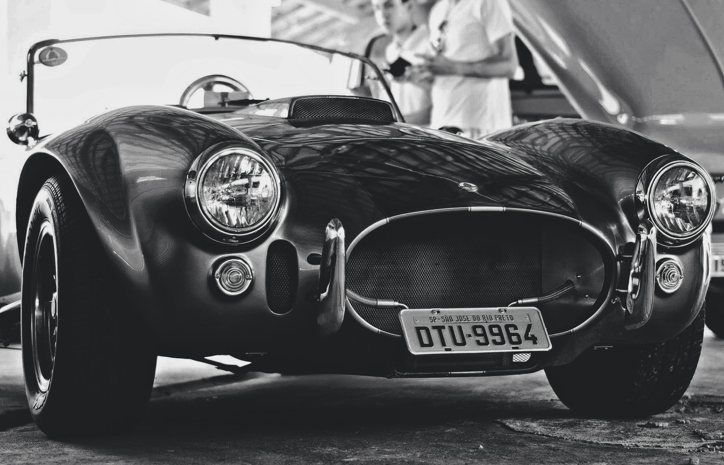 Black and white photo of a classic roadster