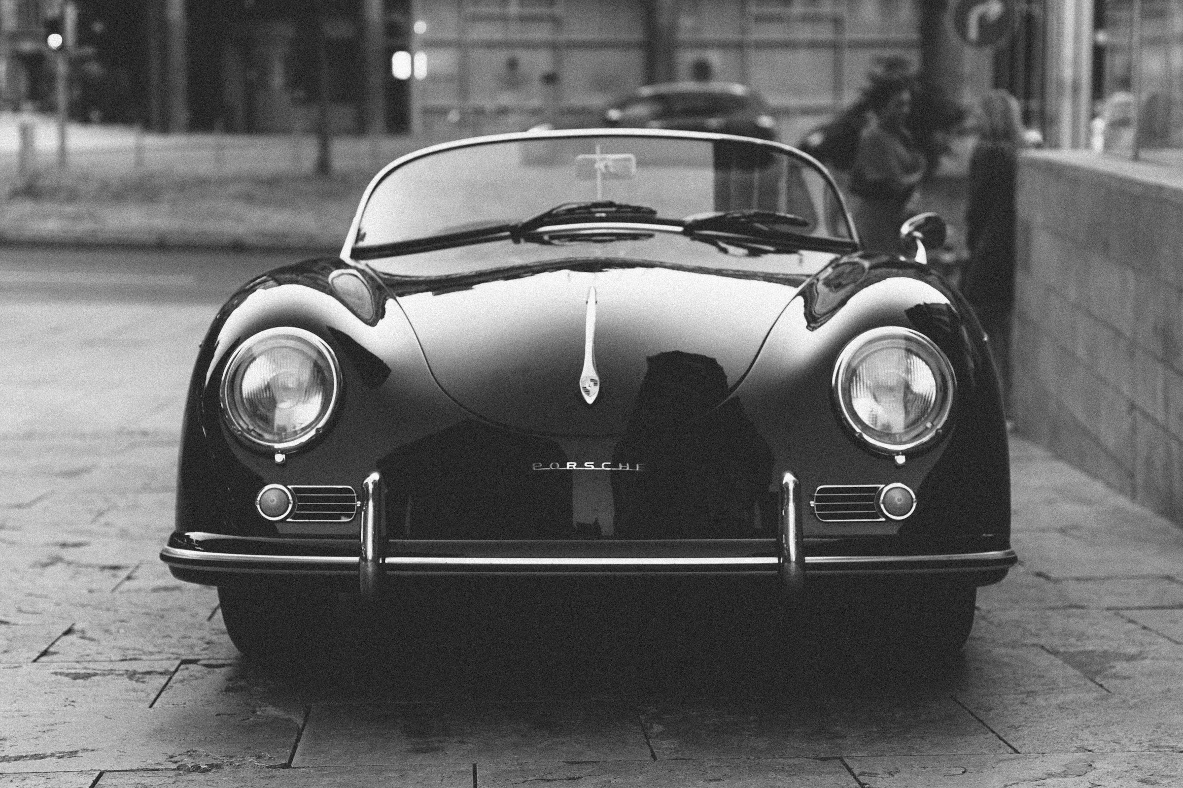 Black and white photo of a classic Porsche roadster