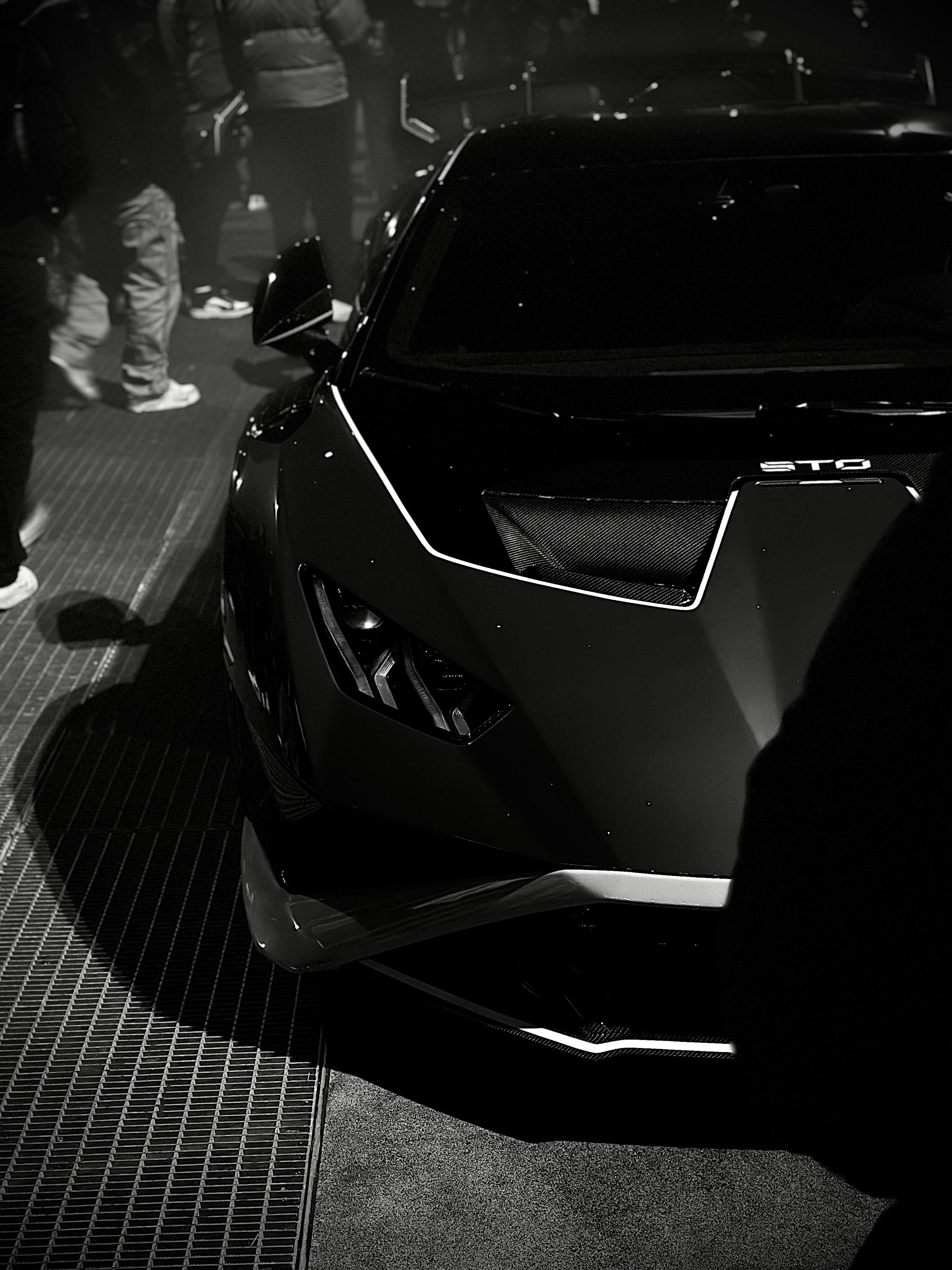 Front of a black modern supercar